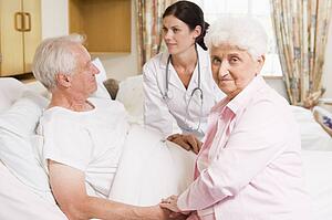 Doctor Talking To Senior Couple