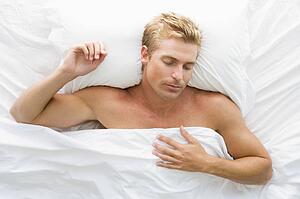 Man lying in bed sleeping