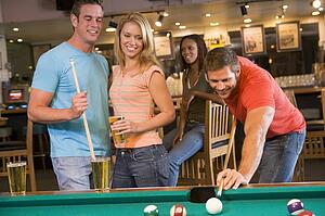 Friends playing pool