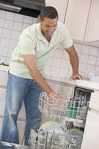 Man Loading Dishwasher 