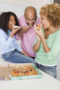 Family Eating Pizza Together 