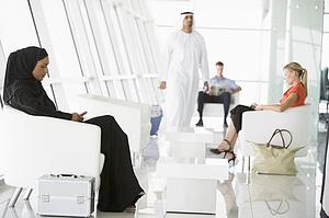 Airline passengers waiting in departure gate