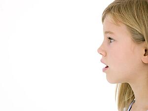 Young girl with mouth open