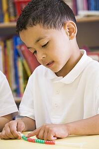 Student in class learning numbers (selective focus)