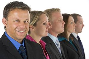 Group Of Business People In A Line Smiling