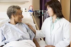 Doctor Talking To Senior Woman