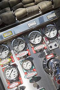 Fire hoses and pressure gauges in fire engine