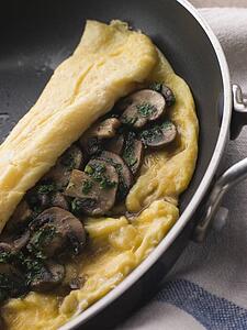 Mushroom Omelette folded in a Omelette Pan