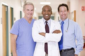 Doctors Standing In A Hospital Corridor