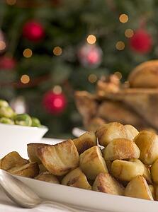 Dish of Roast Potatoes Roast Turkey and Brussel Sprouts