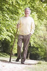 Man walking outdoors smiling