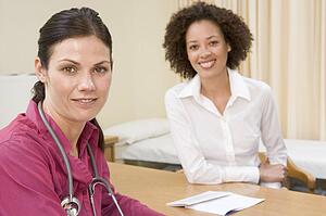 Woman in doctor's office smiling