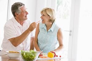 Husband And Wife Preparing meal, mealtime Together