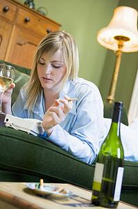 Young woman at home waiting by telephone