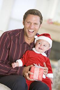 Father With Son In Santa Outfit