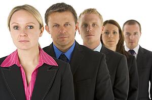 Group Of Business People In A Line Looking Serious 
