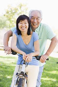Mature couple bike riding.