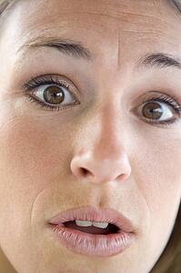Head shot of surprised woman