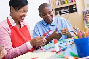 Teacher and student in art class (selective focus)