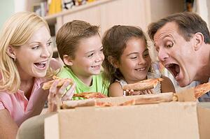 Family Eating Pizza Together 