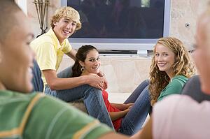 Teenagers Hanging Out In Front Of Television 