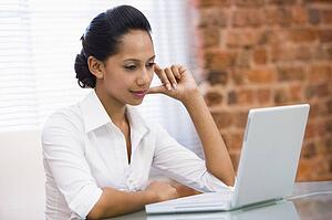 Businesswoman in office with laptop