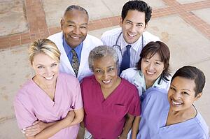 High Angle View Of Hospital Staff Standing Outside A Hospital