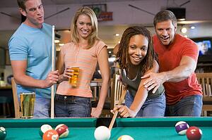 Friends playing pool