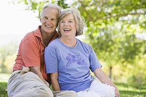 Senior couple sitting outdoors