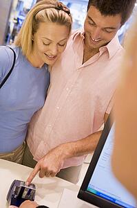 Man paying for purchases with credit card