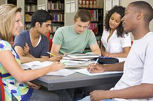 Five people in library studying (selective focus)