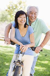 Mature couple bike riding.