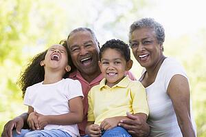 Grandparents laughing with grandchildren.