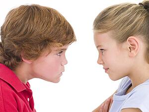 Brother and sister staring at each other