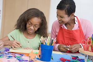 Teacher and student in art class (selective focus)