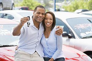 Young couple shopping for a new car