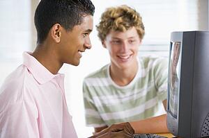 Teenage Boys Using Desktop Computer 