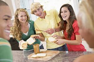 Teenagers Making Sandwiches
