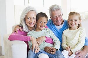 Grandparents posing with grandchildren.