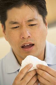 Man Blowing His Nose