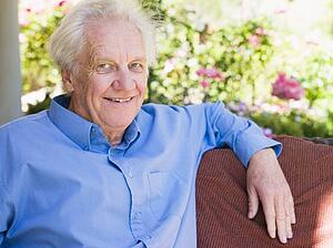 Senior man sitting outdoors
