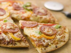 Pepperoni and Pepper Pizza with a Pizza Cutter
