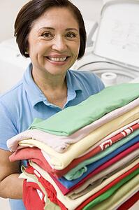 Woman Holding Folded Laundry