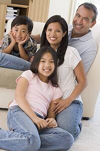 Family in living room smiling