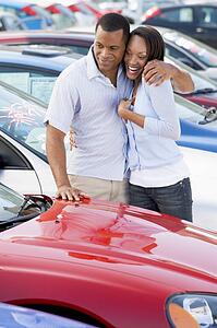 Young couple shopping for a new car