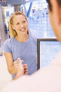 Woman paying for purchases with credit card