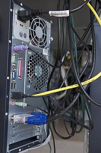 Shot of many cables in the back of a computer modem