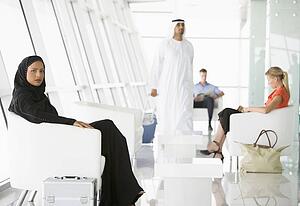 Airline passengers waiting in departure gate