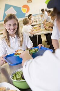 Student having lunch in dining hall