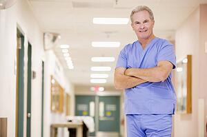 Doctor Standing In A Hospital Corridor